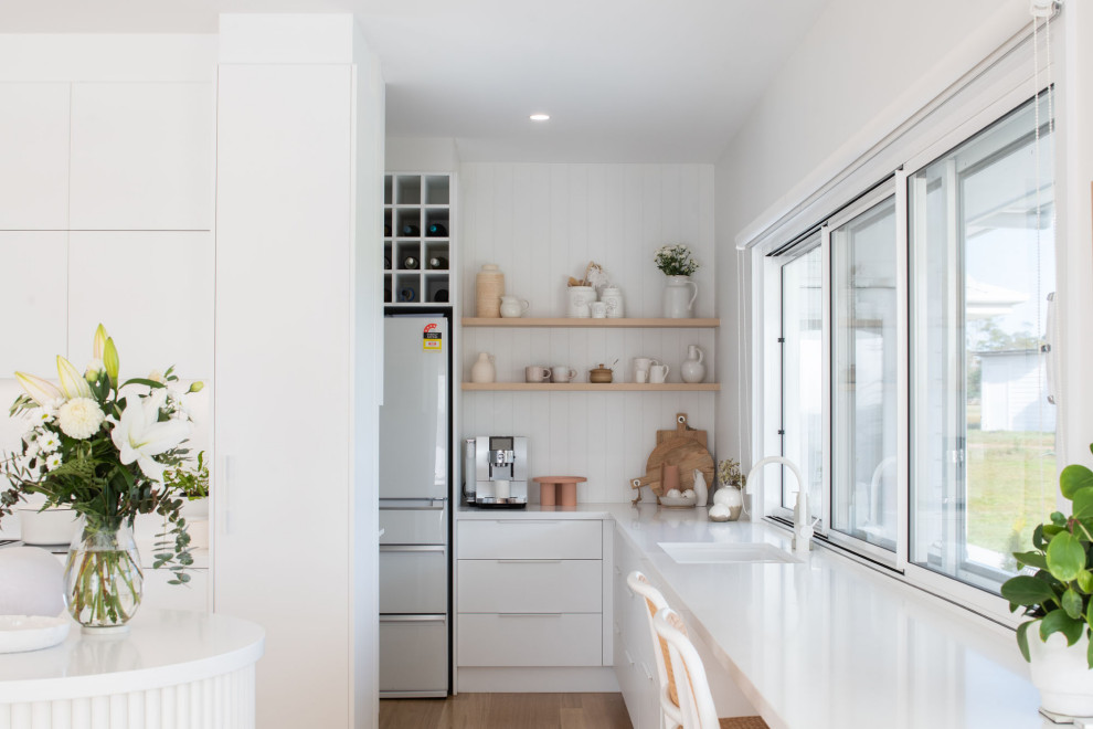 This is an example of a beach style kitchen in Hobart.