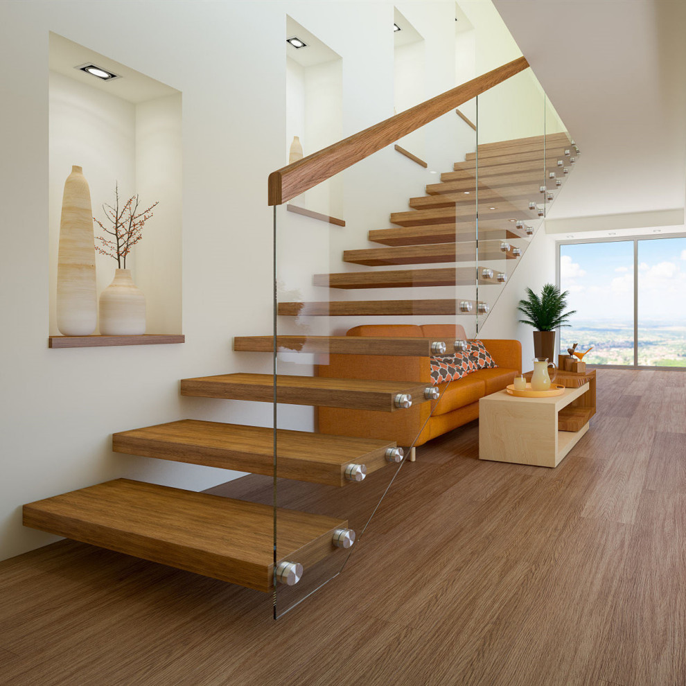 Mid-sized modern glass floating staircase in Other with glass risers, glass railing and panelled walls.