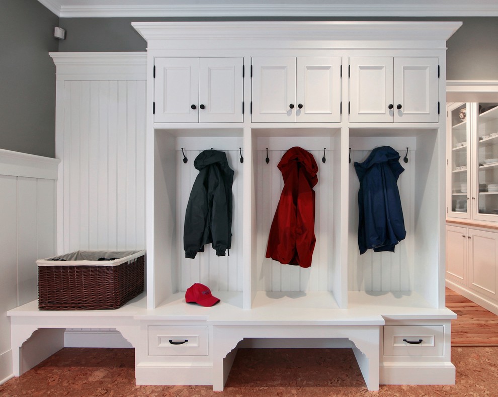 Photo of a traditional mudroom in Other with white walls and cork floors.