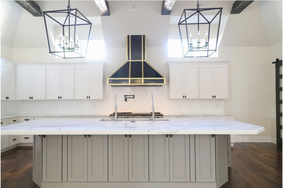 Open concept kitchen - large transitional l-shaped dark wood floor open concept kitchen idea with shaker cabinets, wood countertops, white backsplash, ceramic backsplash, stainless steel appliances, an island, a double-bowl sink and gray cabinets