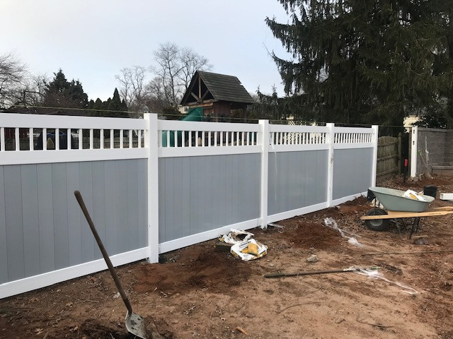 Fence installation after patio and retaining wall