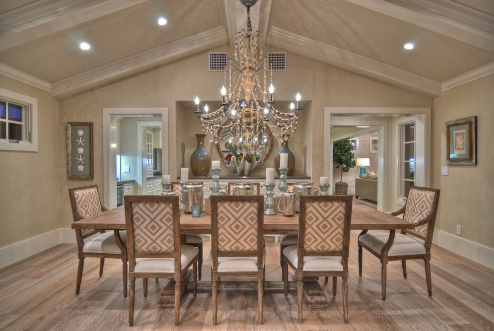 Inspiration for a beach style dining room in Los Angeles with beige walls and medium hardwood floors.