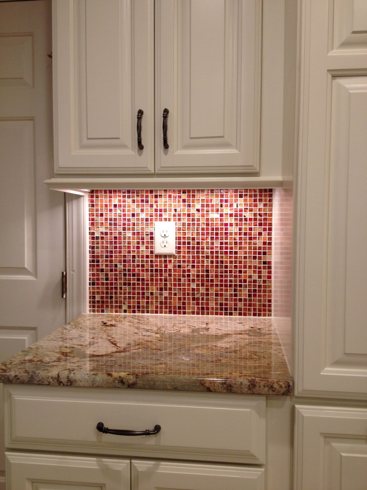 Mid-sized transitional u-shaped ceramic tile eat-in kitchen photo in Richmond with an undermount sink, raised-panel cabinets, white cabinets, granite countertops, white backsplash, subway tile backsplash, stainless steel appliances and a peninsula