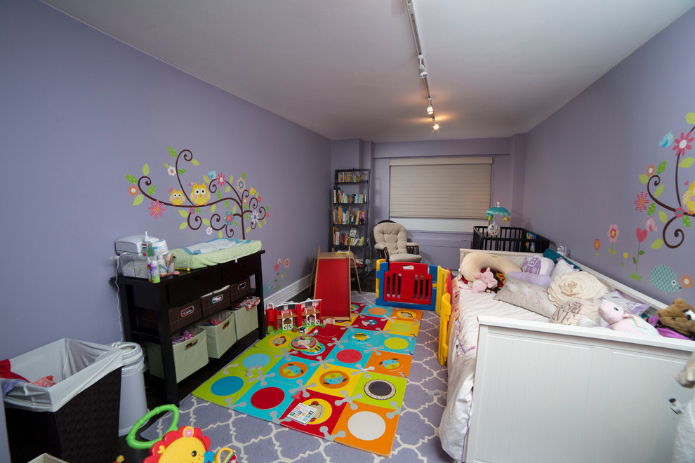 Inspiration for a mid-sized modern gender-neutral nursery in New York with purple walls and dark hardwood floors.