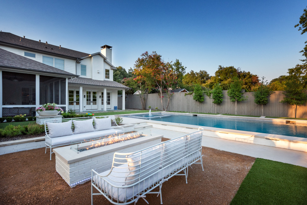 Inspiration for a large transitional backyard rectangular pool in Dallas with with a pool and concrete slab.