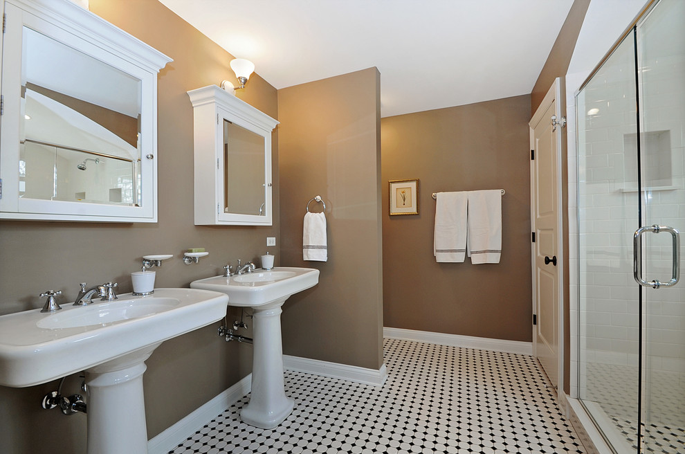 This is an example of a mid-sized traditional master bathroom in Chicago with a pedestal sink, an alcove shower and ceramic tile.