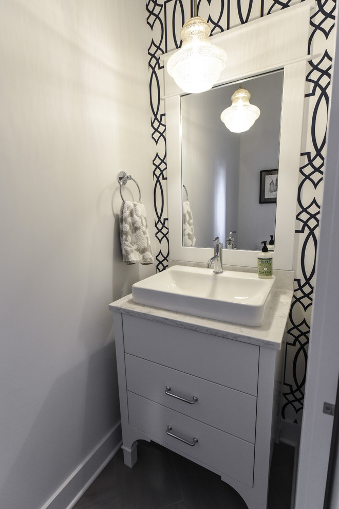 Photo of a transitional powder room in Grand Rapids.