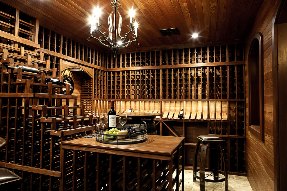 Photo of a large traditional wine cellar in Chicago with travertine floors and storage racks.