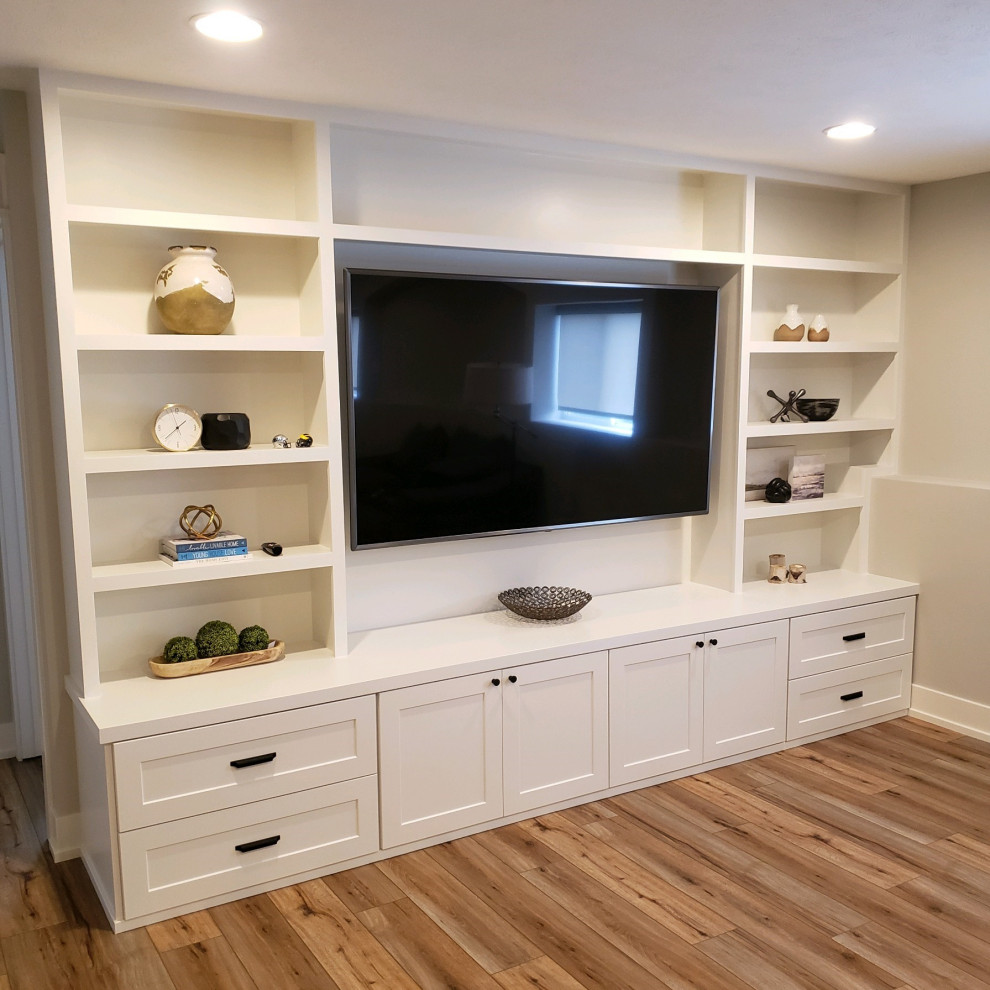 Design ideas for a large living room in Grand Rapids with vinyl flooring and a built-in media unit.