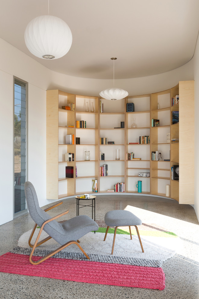 Design ideas for a mid-sized contemporary open concept living room in Sydney with a library and white walls.