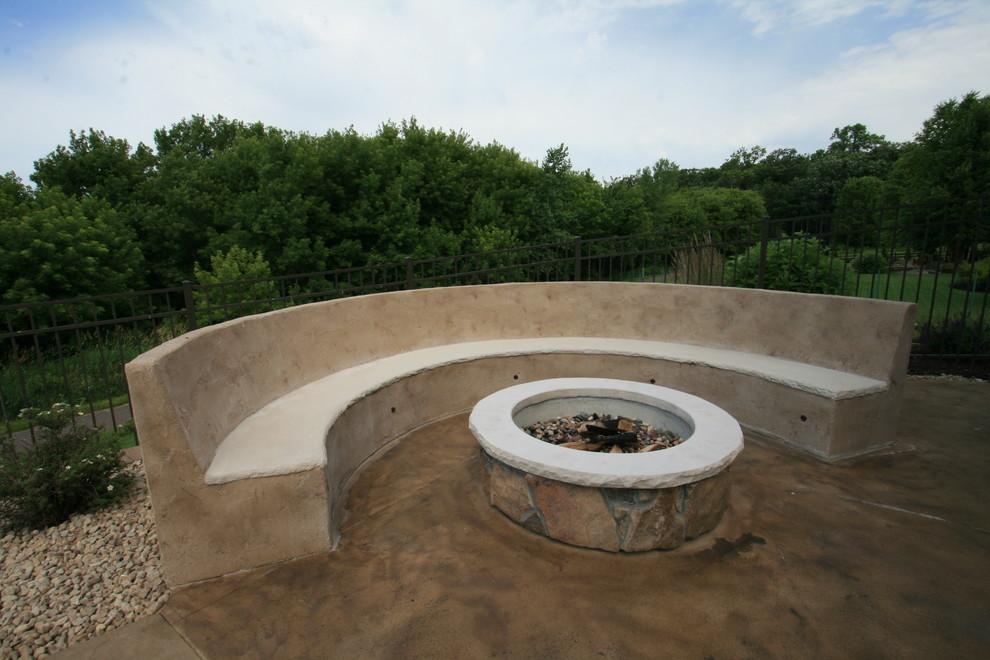 Patio - large contemporary backyard stamped concrete patio idea in Minneapolis with a fire pit