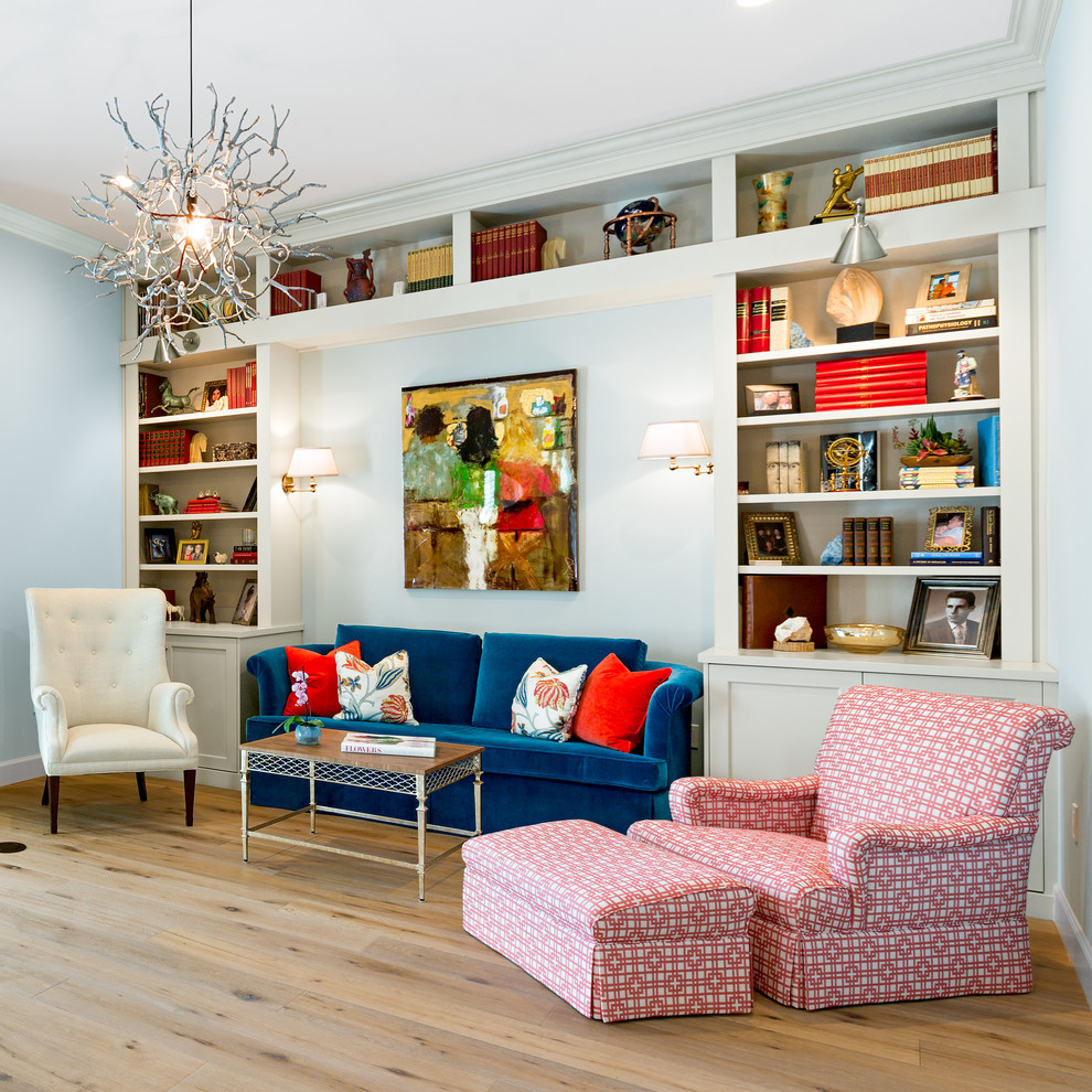 Photo of a mid-sized beach style family room in Tampa with blue walls, medium hardwood floors and brown floor.