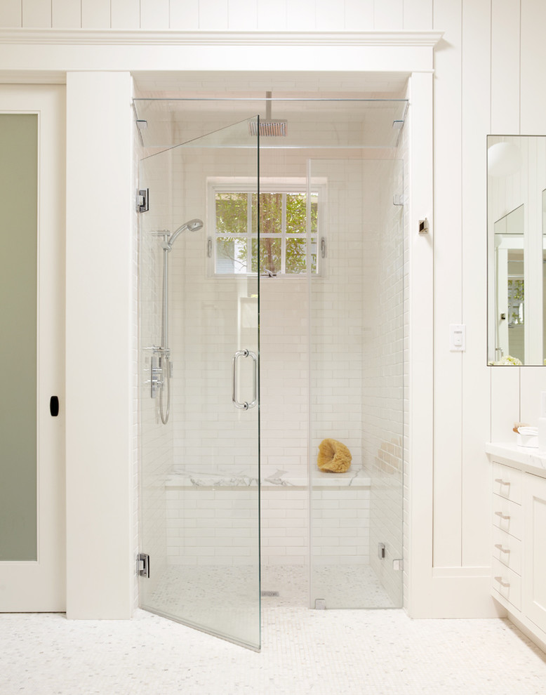 Design ideas for a traditional bathroom in San Francisco with a curbless shower, white tile, subway tile and mosaic tile floors.
