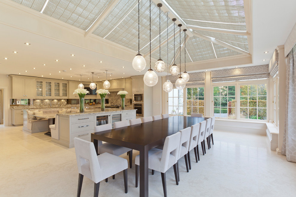 Expansive transitional sunroom in West Midlands with ceramic floors and a skylight.