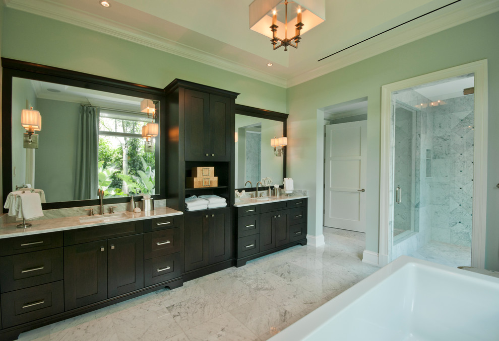 Inspiration for a transitional bathroom in Miami with marble benchtops.
