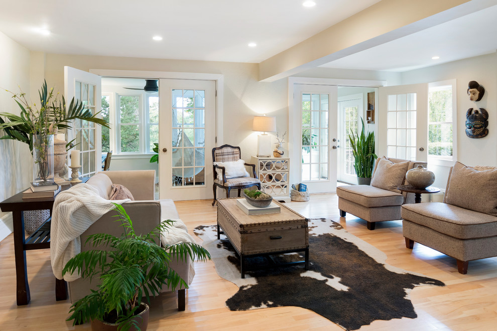 Living room - mid-sized tropical formal and enclosed light wood floor and beige floor living room idea in Minneapolis with beige walls, no fireplace and no tv