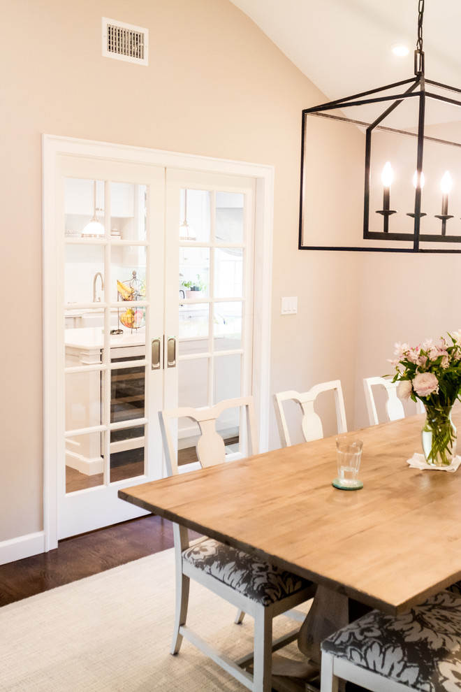 Example of a mid-sized transitional dark wood floor and brown floor dining room design in New York with beige walls