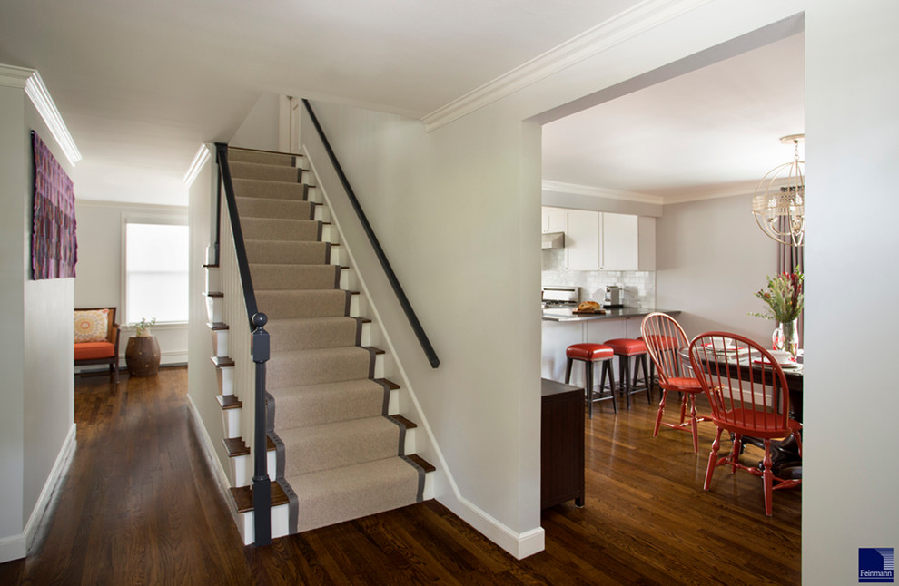 Foyer - mid-sized transitional dark wood floor foyer idea in Boston with white walls
