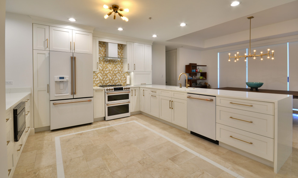 Design ideas for a large transitional u-shaped eat-in kitchen in Miami with an undermount sink, shaker cabinets, white cabinets, quartz benchtops, multi-coloured splashback, ceramic splashback, white appliances, travertine floors, with island, beige floor, white benchtop and coffered.