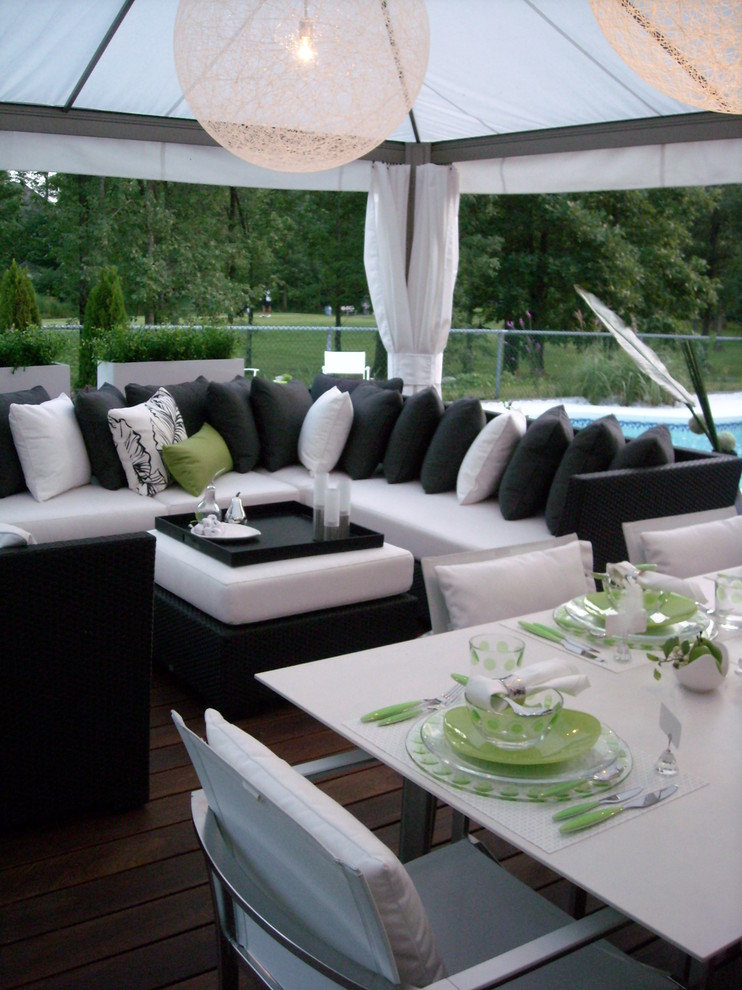 Inspiration for a transitional backyard patio remodel in Montreal