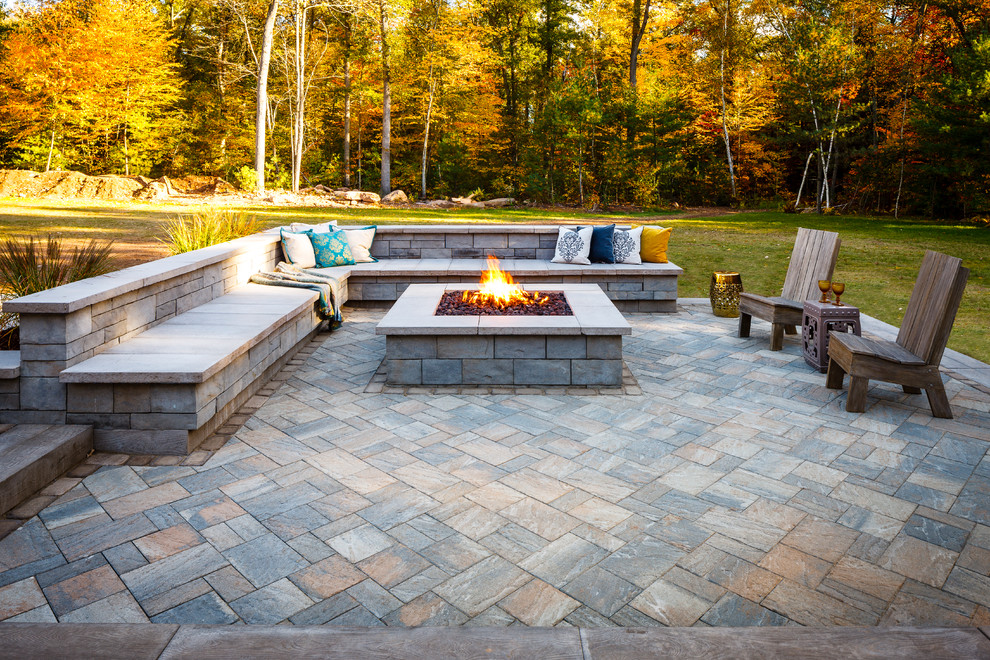 Patio - mid-sized rustic backyard patio idea with a fire pit