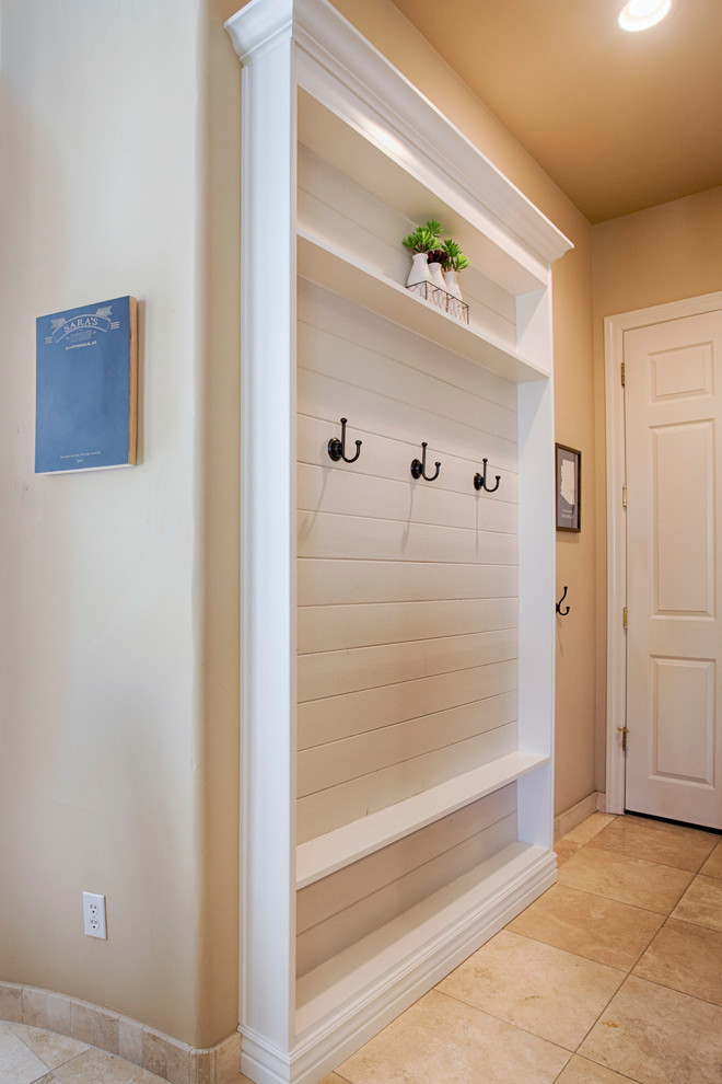 Inspiration for a small transitional travertine floor hallway remodel in Phoenix with beige walls