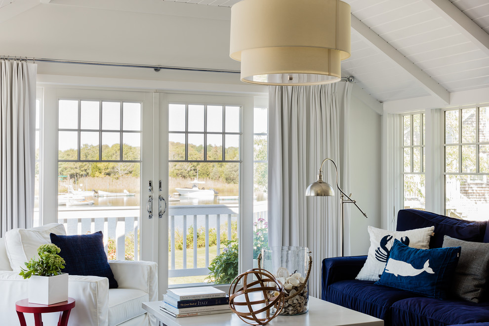 Design ideas for a beach style living room in Boston with white walls.