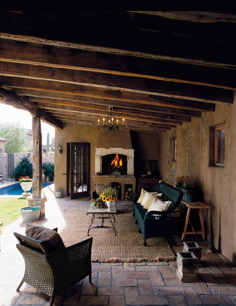 Inspiration for a traditional patio in Phoenix with brick pavers.