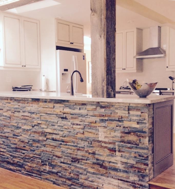 Inspiration for a mid-sized transitional u-shaped light wood floor kitchen pantry remodel in Toronto with a farmhouse sink, recessed-panel cabinets, distressed cabinets, granite countertops, white backsplash, ceramic backsplash, stainless steel appliances and a peninsula