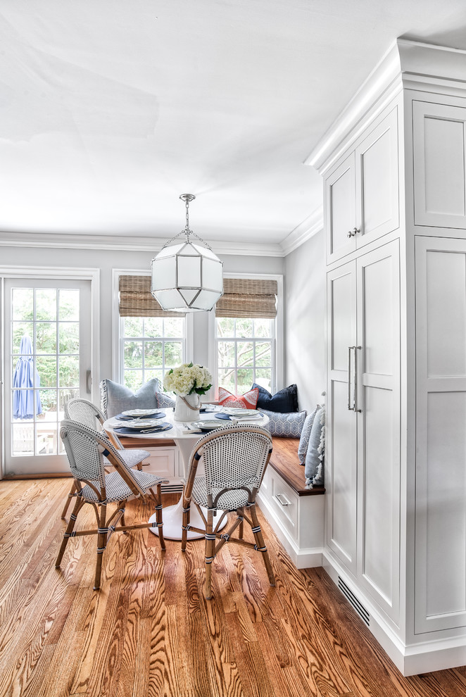 Inspiration for a transitional kitchen/dining combo in New York with grey walls, medium hardwood floors and no fireplace.