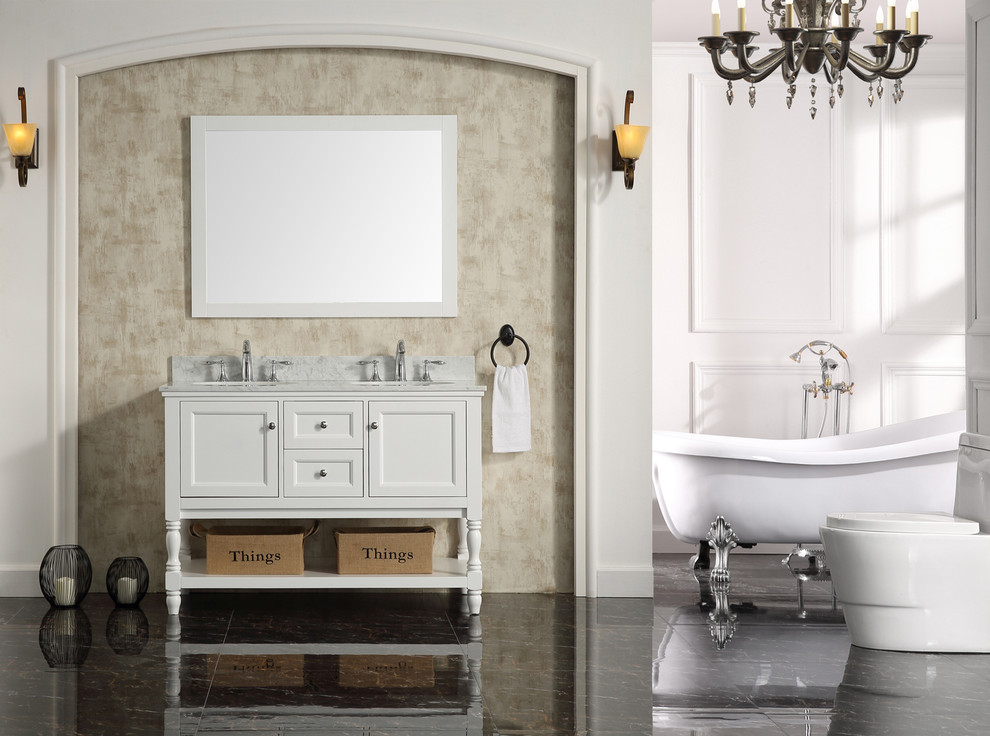 Inspiration for a mid-sized traditional master bathroom in Los Angeles with furniture-like cabinets, white cabinets, a freestanding tub, a one-piece toilet, white walls, ceramic floors, a drop-in sink and marble benchtops.
