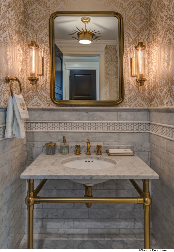 This is an example of a mid-sized traditional powder room in Other with open cabinets, yellow cabinets, a one-piece toilet, gray tile, marble, yellow walls, marble floors, a pedestal sink, marble benchtops, grey floor and grey benchtops.