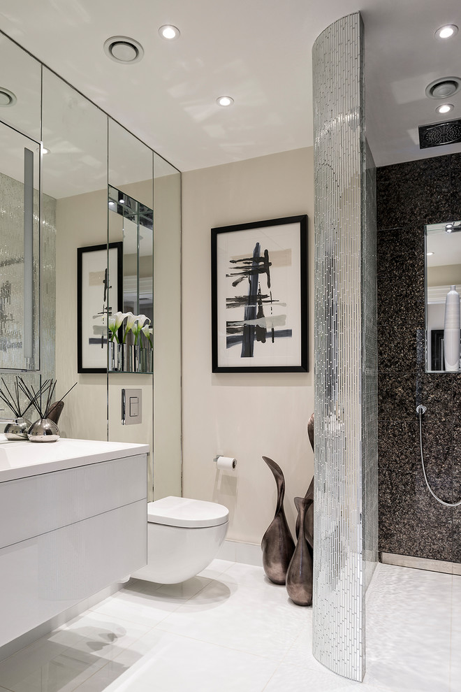 Mid-sized contemporary bathroom in Berkshire with flat-panel cabinets, white cabinets, an open shower, a wall-mount toilet, beige walls, a wall-mount sink, white floor and an open shower.