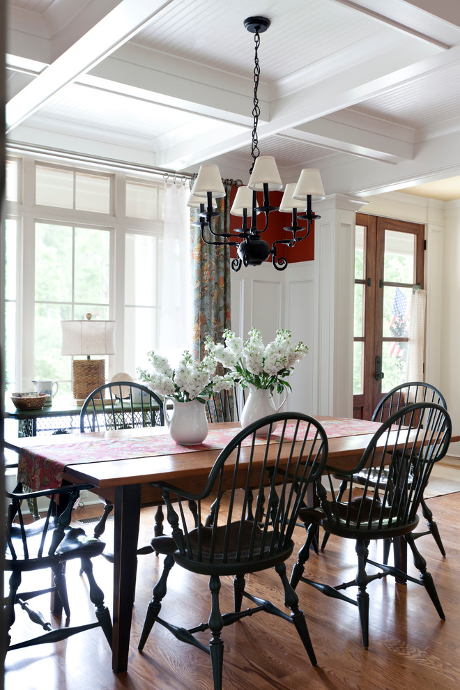 This is an example of a traditional dining room in Little Rock with medium hardwood floors.