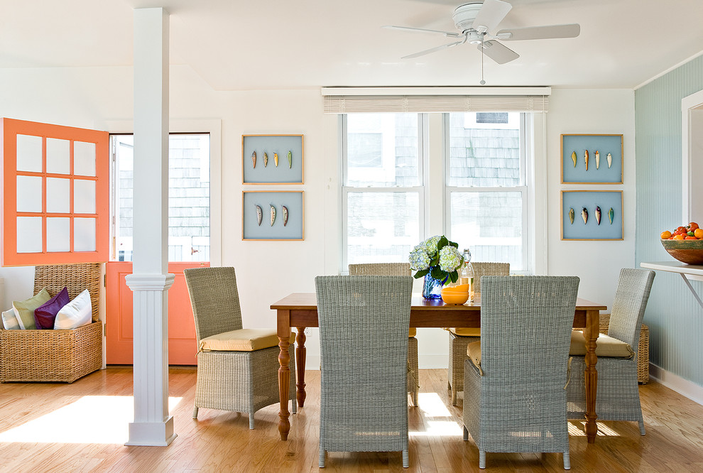 Photo of a small beach style kitchen/dining combo in Boston with white walls and light hardwood floors.