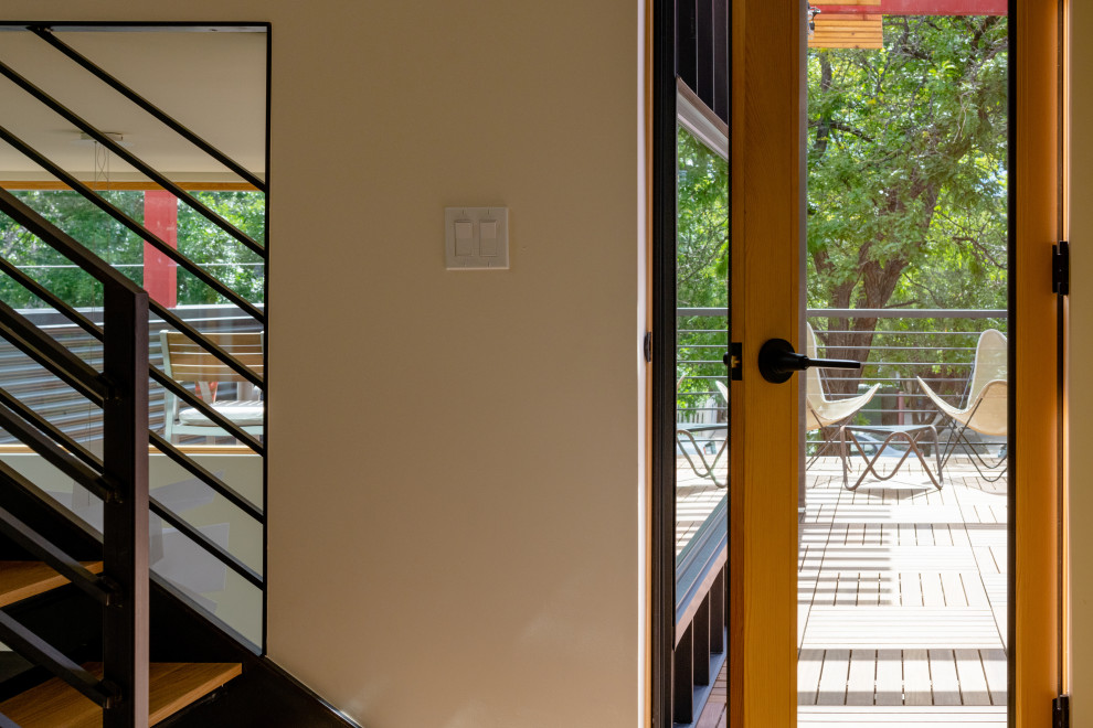 Deck - mid-sized industrial rooftop deck idea in Denver with a pergola