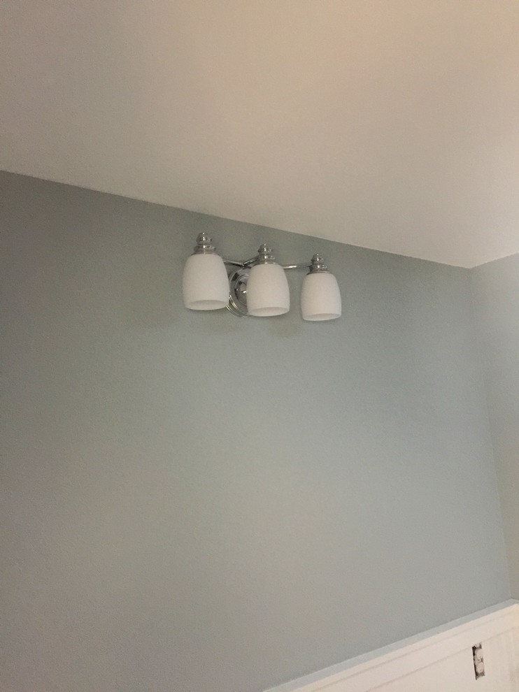 Mid-sized transitional hallway photo with blue walls