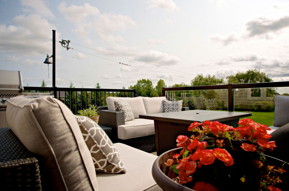 Inspiration for a mid-sized backyard second story mixed material railing outdoor kitchen deck remodel with no cover