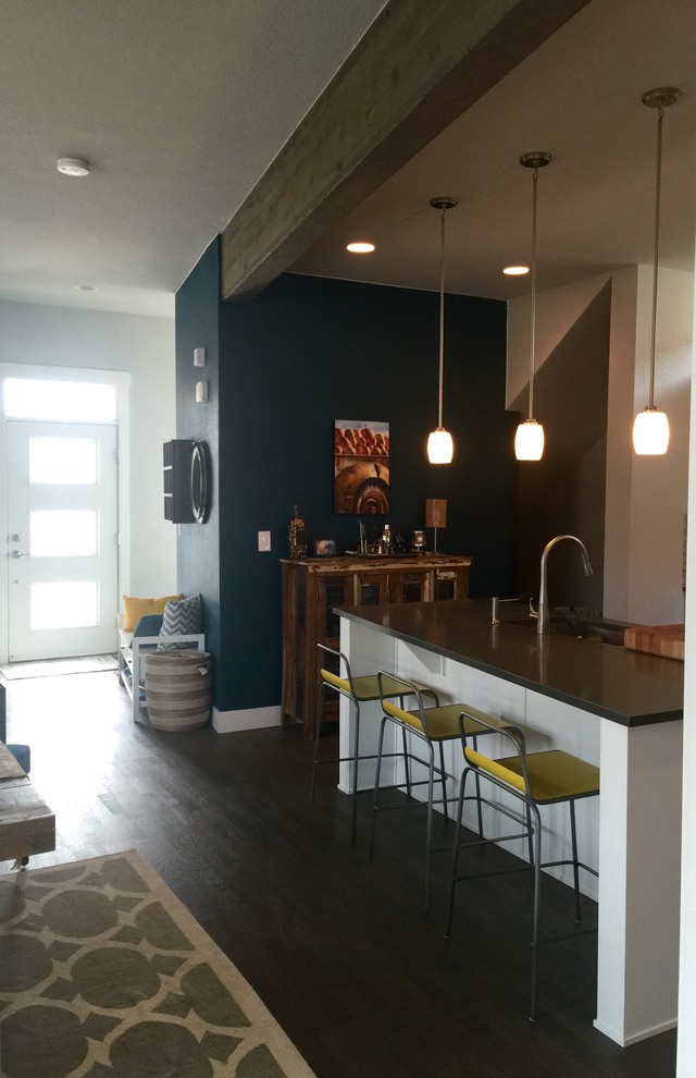 Kitchen - transitional medium tone wood floor kitchen idea in Denver with a single-bowl sink, recessed-panel cabinets, white cabinets, quartz countertops and stainless steel appliances
