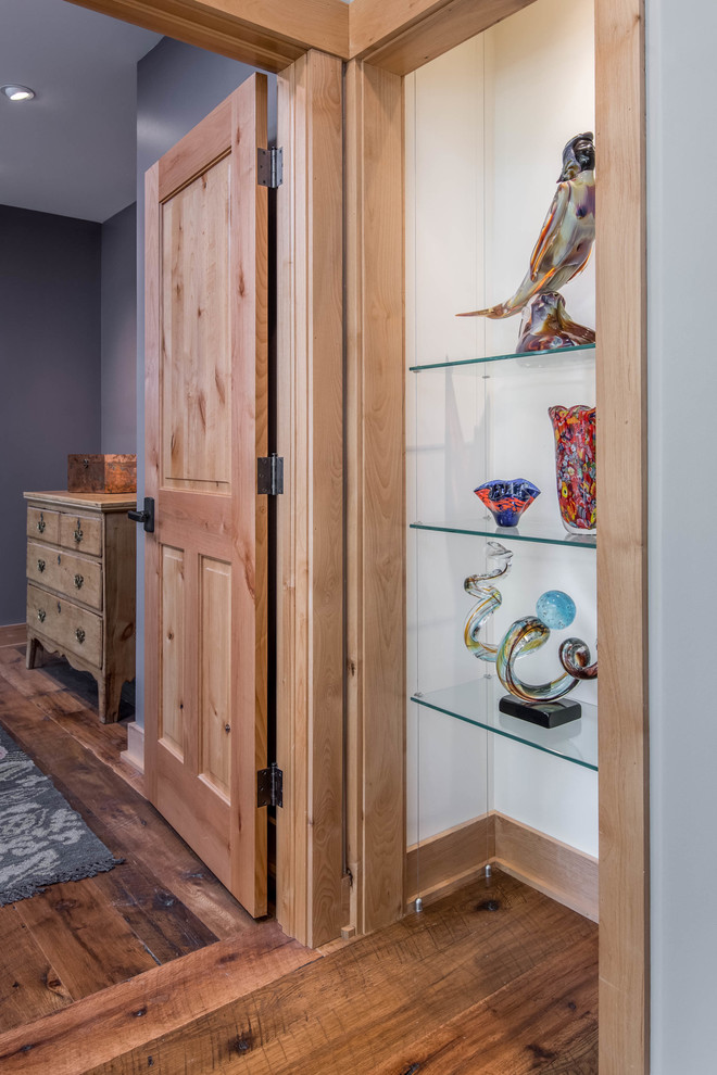 Hallway - mid-sized rustic dark wood floor and brown floor hallway idea with gray walls