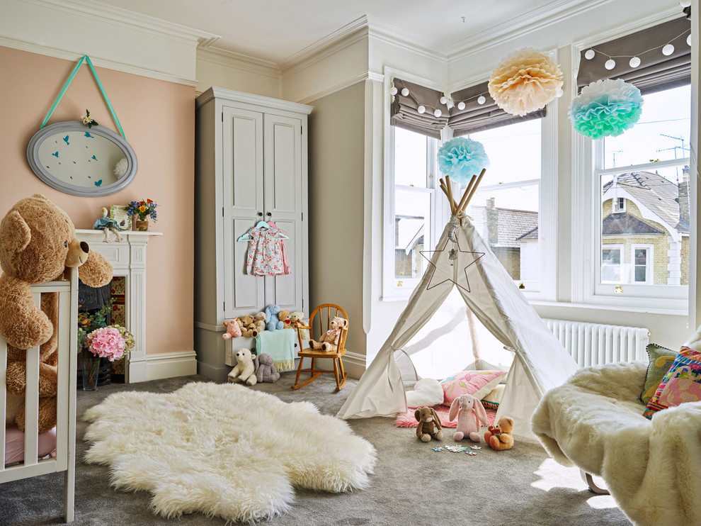 This is an example of a mid-sized transitional nursery in Other with grey walls, carpet and grey floor.