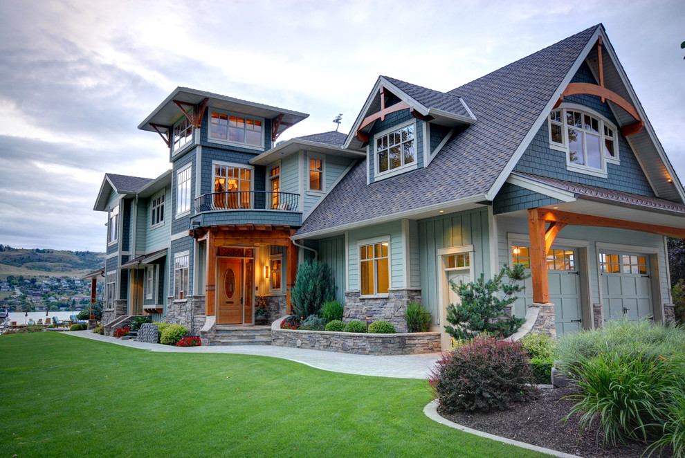 Design ideas for a traditional two-storey exterior in Vancouver with wood siding.