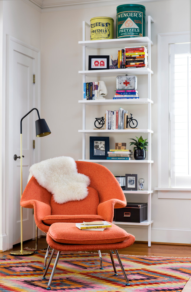 This is an example of a mid-sized eclectic home office in Atlanta with dark hardwood floors and a built-in desk.