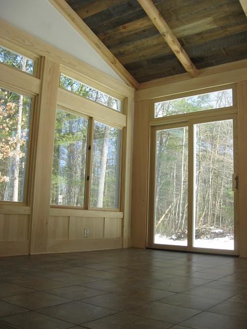 This is an example of a mid-sized country sunroom in Boston with ceramic floors, no fireplace and a standard ceiling.