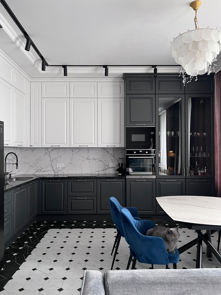 This is an example of a large transitional l-shaped open plan kitchen in Moscow with raised-panel cabinets.