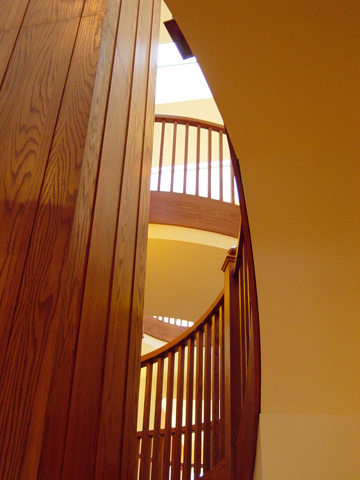 Inspiration for an expansive eclectic wood floating staircase in Chicago with wood risers and wood railing.