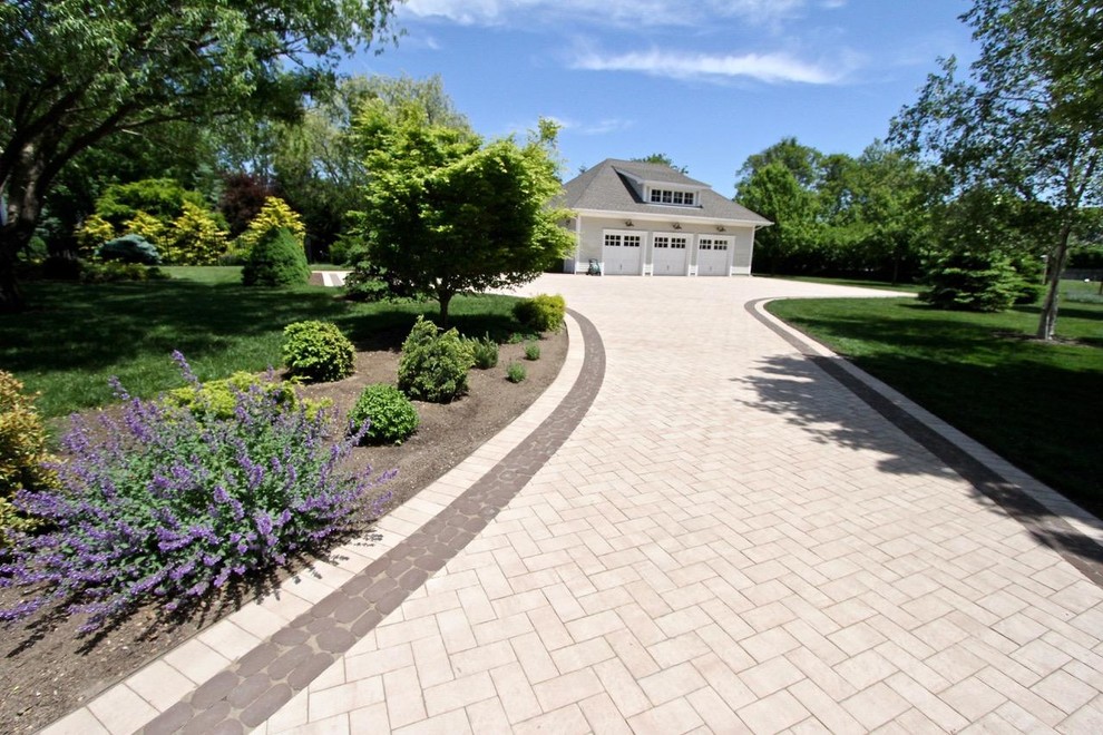 Large modern front yard patio in New York with natural stone pavers and a gazebo/cabana.