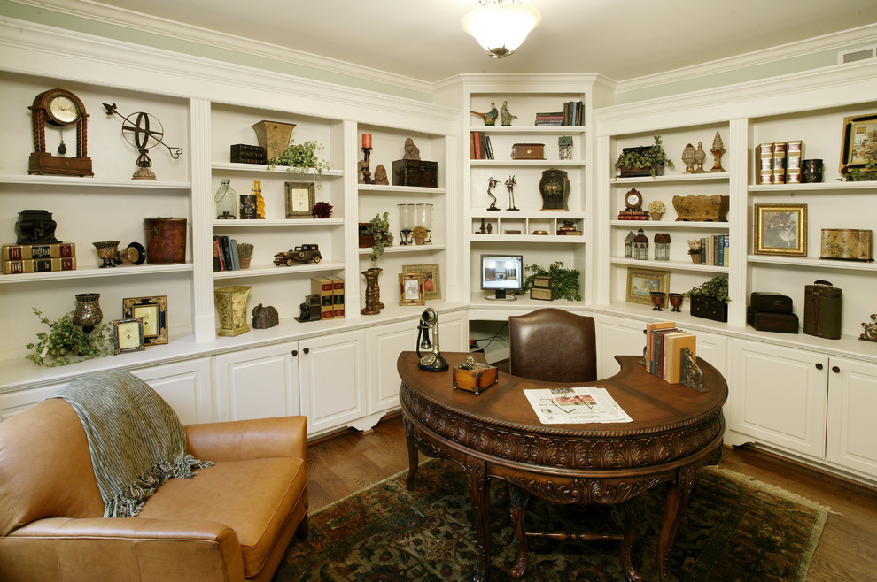 Inspiration for a traditional home office in Cincinnati with dark hardwood floors and a freestanding desk.