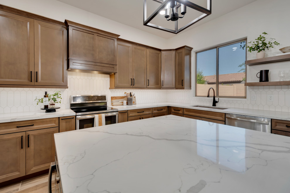 Eat-in kitchen - mid-sized transitional u-shaped ceramic tile and brown floor eat-in kitchen idea in Phoenix with beaded inset cabinets, brown cabinets, quartzite countertops, white backsplash, ceramic backsplash, an island and white countertops