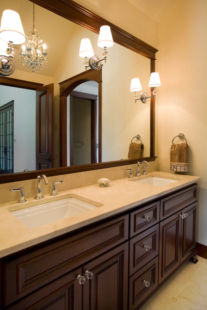 Photo of a large traditional bathroom in Other with an undermount sink, furniture-like cabinets, medium wood cabinets, marble benchtops, an undermount tub, beige tile, stone slab, beige walls, marble floors and with a sauna.
